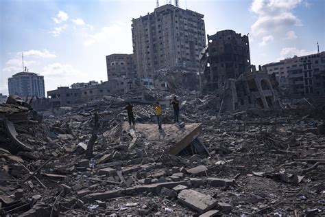 Israel strikes Gaza neighborhoods, as people scramble for safety in sealed-off territory